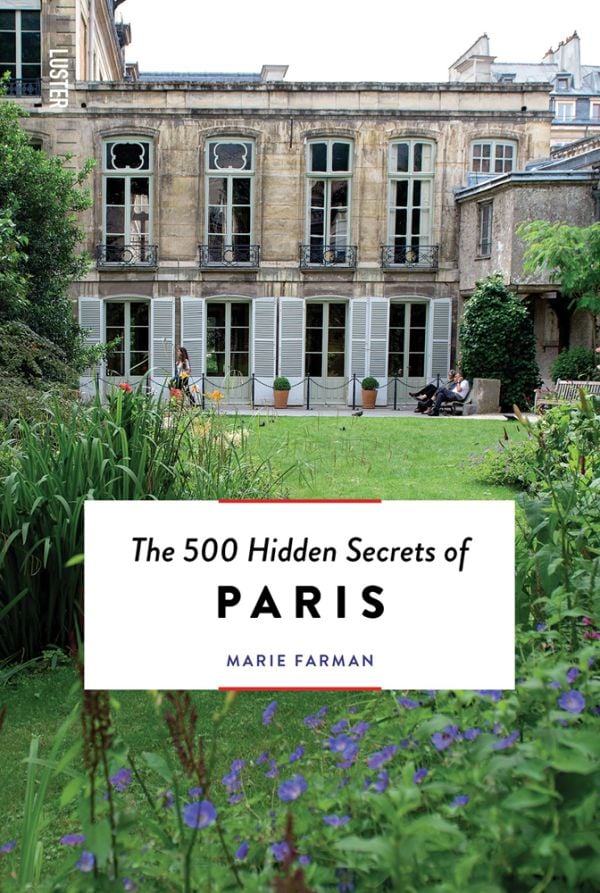 Book cover of The 500 Hidden Secrets of Paris, featuring the Hotel d'Assy and lush green gardens. Published by Luster Publishing.
