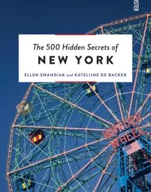 Low angled shot of Deno's Wonder Wheel Amusement park Ferris wheel, on cover of 'The 500 Hidden Secrets of New York', by Luster Publishing.