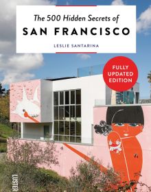 Book cover of The 500 Hidden Secrets of San Francisco, with a pink mural on wall of Helipad House, of a lady with tattoos. Published by Luster Publihsing.