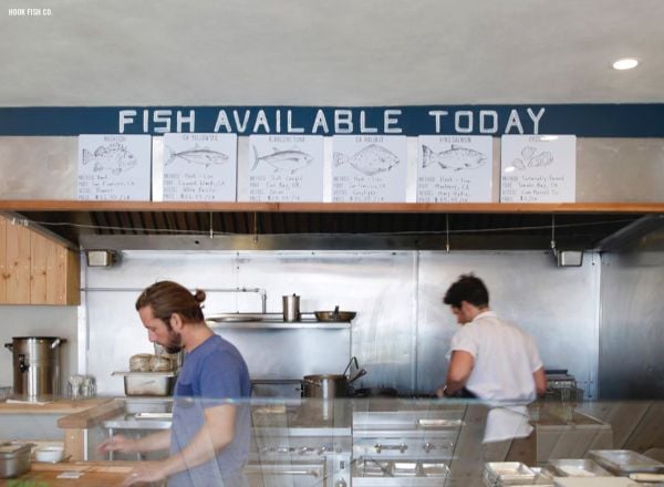 Book cover of The 500 Hidden Secrets of San Francisco, with a pink mural on wall of Helipad House, of a lady with tattoos. Published by Luster Publihsing.