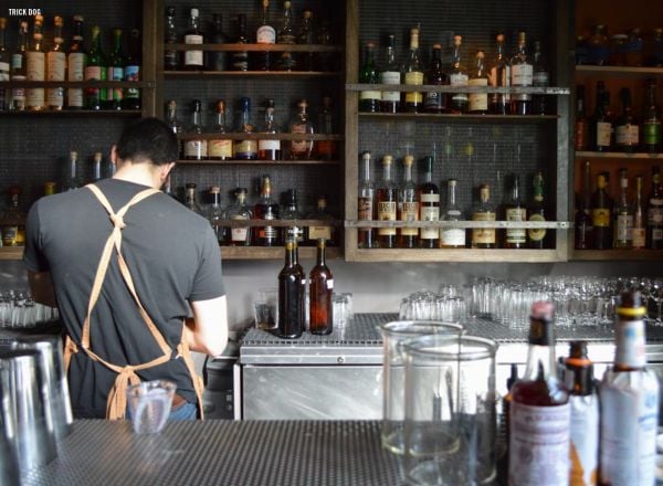 Book cover of The 500 Hidden Secrets of San Francisco, with a pink mural on wall of Helipad House, of a lady with tattoos. Published by Luster Publihsing.