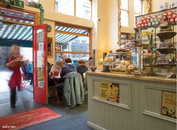 Book cover of The 500 Hidden Secrets of Dublin, with a fishing boat at Bulloch Harbour, Dalkey, under blue sky. Published by Luster Publishing.