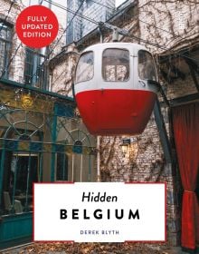 Book cover of Hidden Belgium, with a red and white cable car on wire. Published by Luster Publishing.