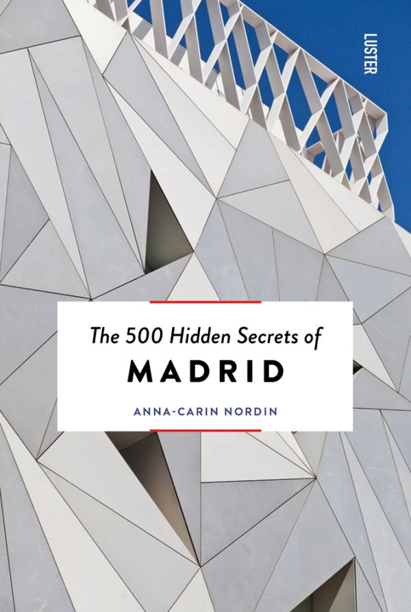 Book cover of The 500 Hidden Secrets of Madrid, with the white exterior of ABC Museum in Madrid. Published by Luster Publishing.