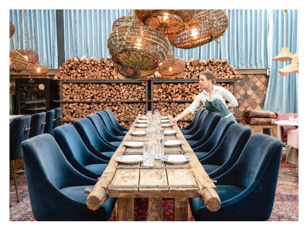 Book cover of The 500 Hidden Secrets of Chicago, with an abstract mural in blue, orange and cream, on exterior of Gensler's Chicago office. Published by Luster Publishing.