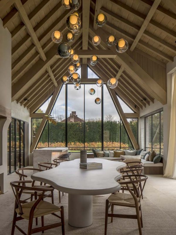 Linen book cover of Morph?, Van Damme - Vandeputte Architects, with an Interior space with low black coffee-table, white bust sculpture on plinth, wood chair, and white marble fireplace. Published by Luster Publishing.