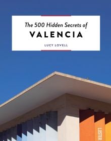 Guide book cover of The 500 Hidden Secrets of Valencia, with corner of building with blue and orange vertical slats. Published by Luster Publishing.