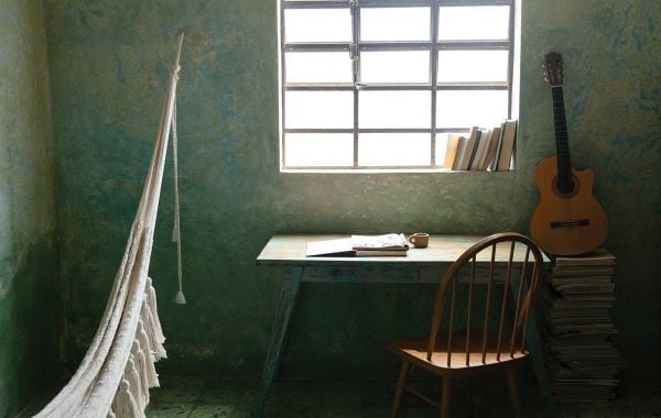 Book cover of By the Sea: Inspiring Coastal Houses and Refuges, with an interior of coastal home made of wood. Published by Luster Publishing.