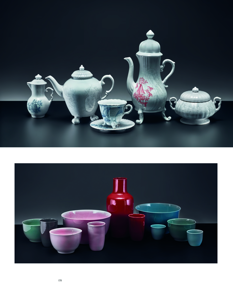 Collection of Dutch ceramic vessels, painted with flowers, on grey cover, Made in Holland in white font to centre