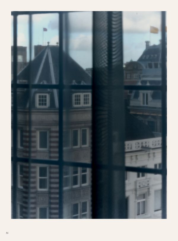 Book cover of Alice Taagten's The Palace: Royal Palace Amsterdam, with a dark interior place room. Published by Waanders Publishers.