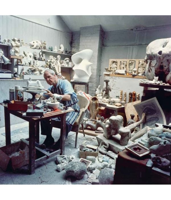 Book cover of Henry Moore: Form and Material, with the artist holding his hands palm-face up to the camera. Published by Waanders Publishers.