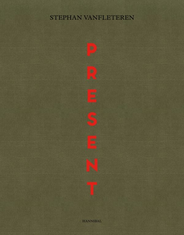 Capitalized red font down center of dark green cover of 'Present', by Hannibal Books.