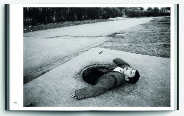 Capitalized red font down center of dark green cover of 'Present', by Hannibal Books.