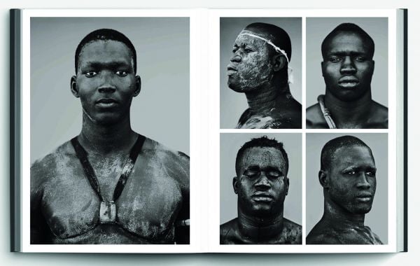 Capitalized red font down center of dark green cover of 'Present', by Hannibal Books.