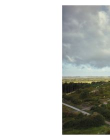 Sandy landscape with dark moody clouds above, small shack on silts, on landscape cover of 'Eiland', by Hannibal Books.