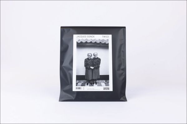 Book cover of Twice: Jacques Sonck, with two figures holding hands. Published by Hopper&Fuchs.