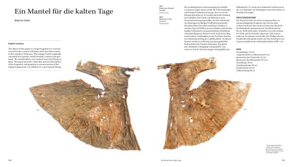 Two pieces of aging Egyptian embroidered cloth, on white cover of 'Explorers, First Collectors and Traders of Textiles', by Hannibal Books.