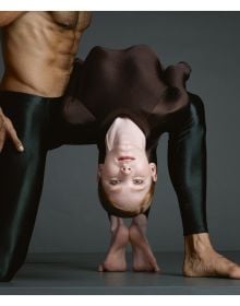 Torso of white male in black pants, white female hand on crotch area, on beige linen cover of 'Dance in Close-Up, Hans van Manen seen by Erwin Olaf', by Hannibal Books.