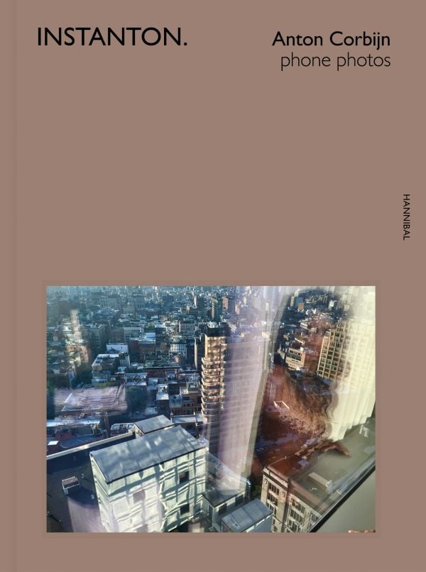 Book cover of Instanton, Phone Photos, featuring Australian singer songwriter Nick Cave, with eyes closed and fingers on temples. Published by Hannibal Books.