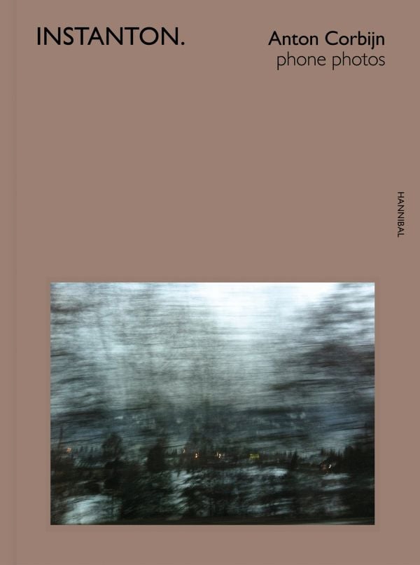 Book cover of Instanton, Phone Photos, featuring Australian singer songwriter Nick Cave, with eyes closed and fingers on temples. Published by Hannibal Books.