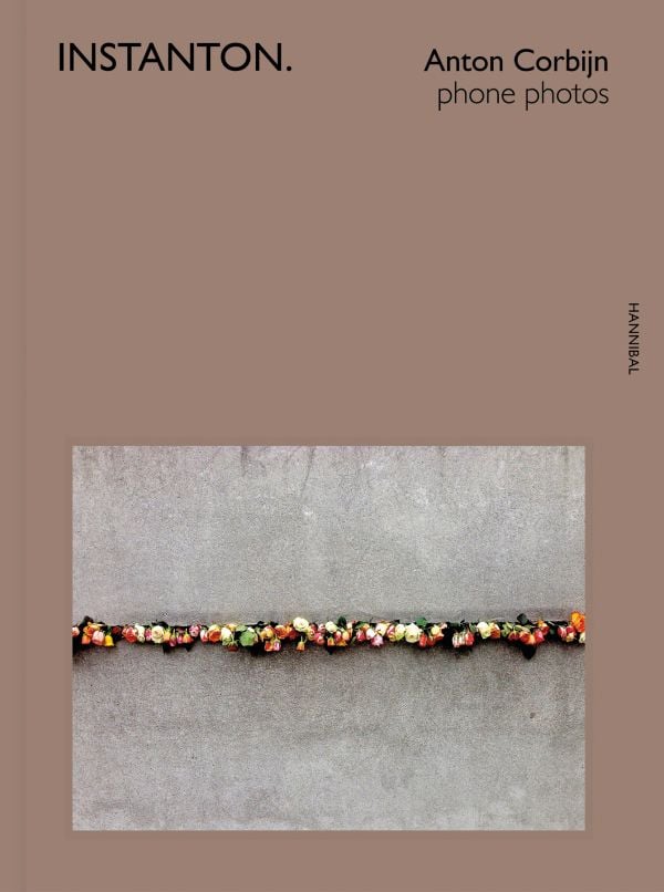 Book cover of Instanton, Phone Photos, featuring Australian singer songwriter Nick Cave, with eyes closed and fingers on temples. Published by Hannibal Books.