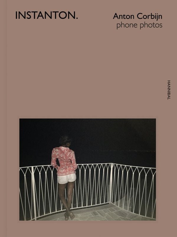 Book cover of Instanton, Phone Photos, featuring Australian singer songwriter Nick Cave, with eyes closed and fingers on temples. Published by Hannibal Books.