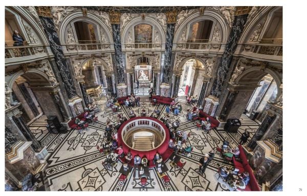 Art museum with statues in front, on cover of 'Kunsthistorisches Museum Vienna, The Official Museum Book', by Hannibal Books.
