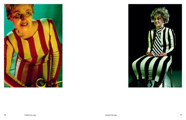 Book cover of Cindy Sherman: Anti-Fashion, with the artist dressed as a clown, wearing a pink curly wig. Published by Hannibal Books.