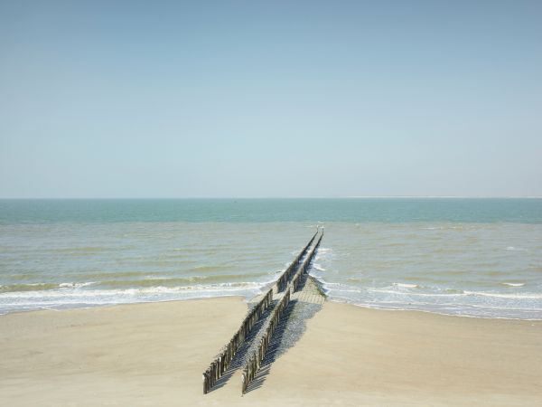 Book cover of Jeroen Hofman's Zeeland, with a vast green landscape. Published by Hannibal Books.