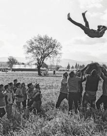 Book cover of The Family of Migrants, featuring crowds of people. Published by Silvana.