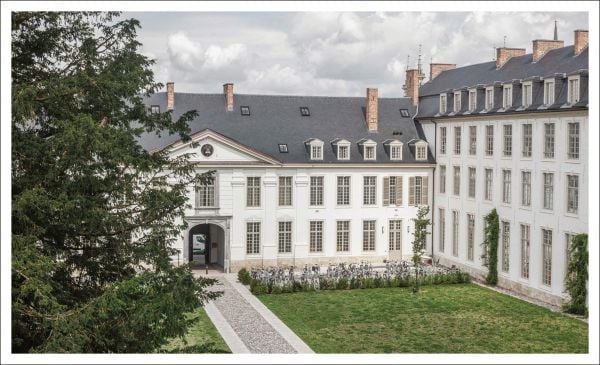 Book cover of KU Leuven: Images of a University, featuring the hallways of the building. Published by Hannibal Books.