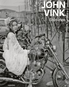 Book cover of Sidelines: John Vink, featuring a black dog and workers picking plants from water. Published by Hannibal Books.