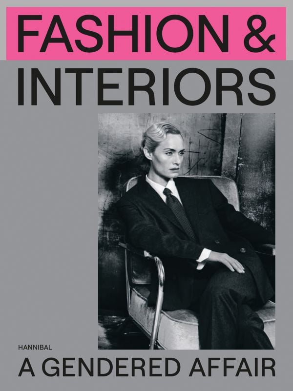 Book cover of Fashion & Interiors: A Gendered Affair, featuring American model and actress Amber Valletta dressed in a suit. Published by Hannibal Books.