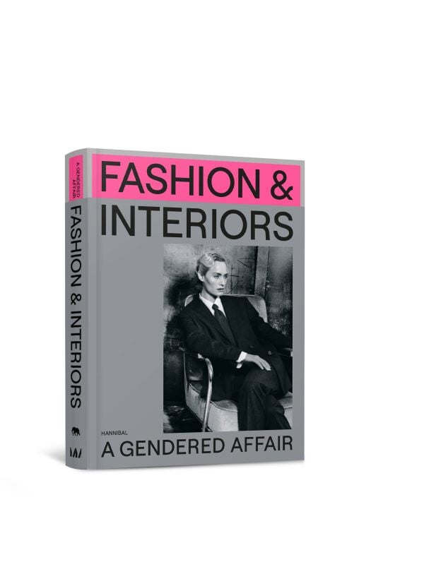 Book cover of Fashion & Interiors: A Gendered Affair, featuring American model and actress Amber Valletta dressed in a suit. Published by Hannibal Books.