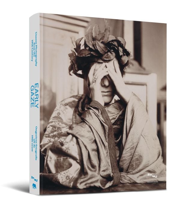 Book cover of Early Gaze: Unseen Photography of the 19th Century; featuring a figure wearing robes and a headpiece made of fabric leaves. Published by Hannibal Books.