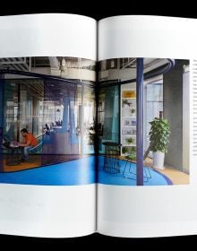 Book cover of 70 Ideas From Global Best Interior Design II, with a white interior living space with sofas, a table with vases and unit. Published by Artpower International.