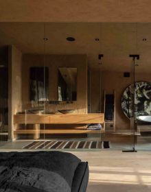 Interior living space in brown tones, with mosaic fronted cabinet on cover of 'Contemporary Wabi-Sabi Style', by Artpower International.