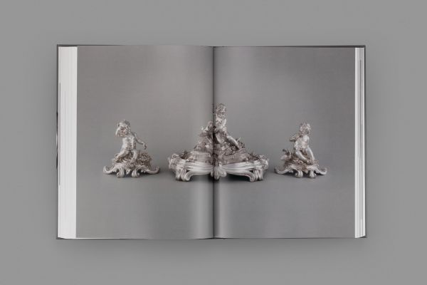 Book cover of The French Silverware in the Calouste Gulbenkian Collection; featuring a silver figure of a child. Published by Fundação Calouste Gulbenkian.