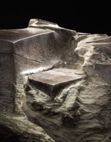 Book cover of Yves Dana, A Fresh Perspective on Sculpture, featuring a large white bone-like sculpture with surface carvings. Published by 5 Continents Editions.