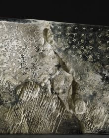 Book cover of Yves Dana, A Fresh Perspective on Sculpture, featuring a large white bone-like sculpture with surface carvings. Published by 5 Continents Editions.