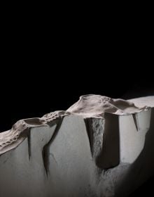 Book cover of Yves Dana, A Fresh Perspective on Sculpture, featuring a large white bone-like sculpture with surface carvings. Published by 5 Continents Editions.