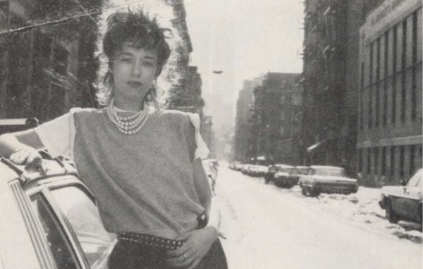 Book cover of Samantha McEwen: London | Paris | New York. Works and Life from the 1980s to the Present, with the artist pictured on the phone. Published by 5 Continents Editions.