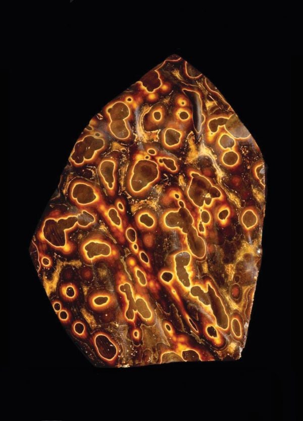 Book cover of Written in Stone: Minerals collected and described by Roger Caillois, with an orange and blue semi-precious stone. Published by Franco Maria Ricci editore.