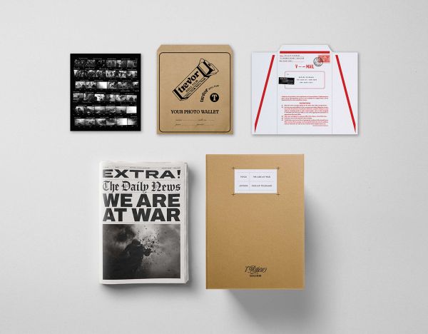 Book cover of We Are At War; with newspaper articles and brown document folders. Published by L'Artiere.