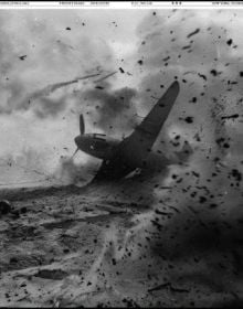 Book cover of We Are At War; with newspaper articles and brown document folders. Published by L'Artiere.